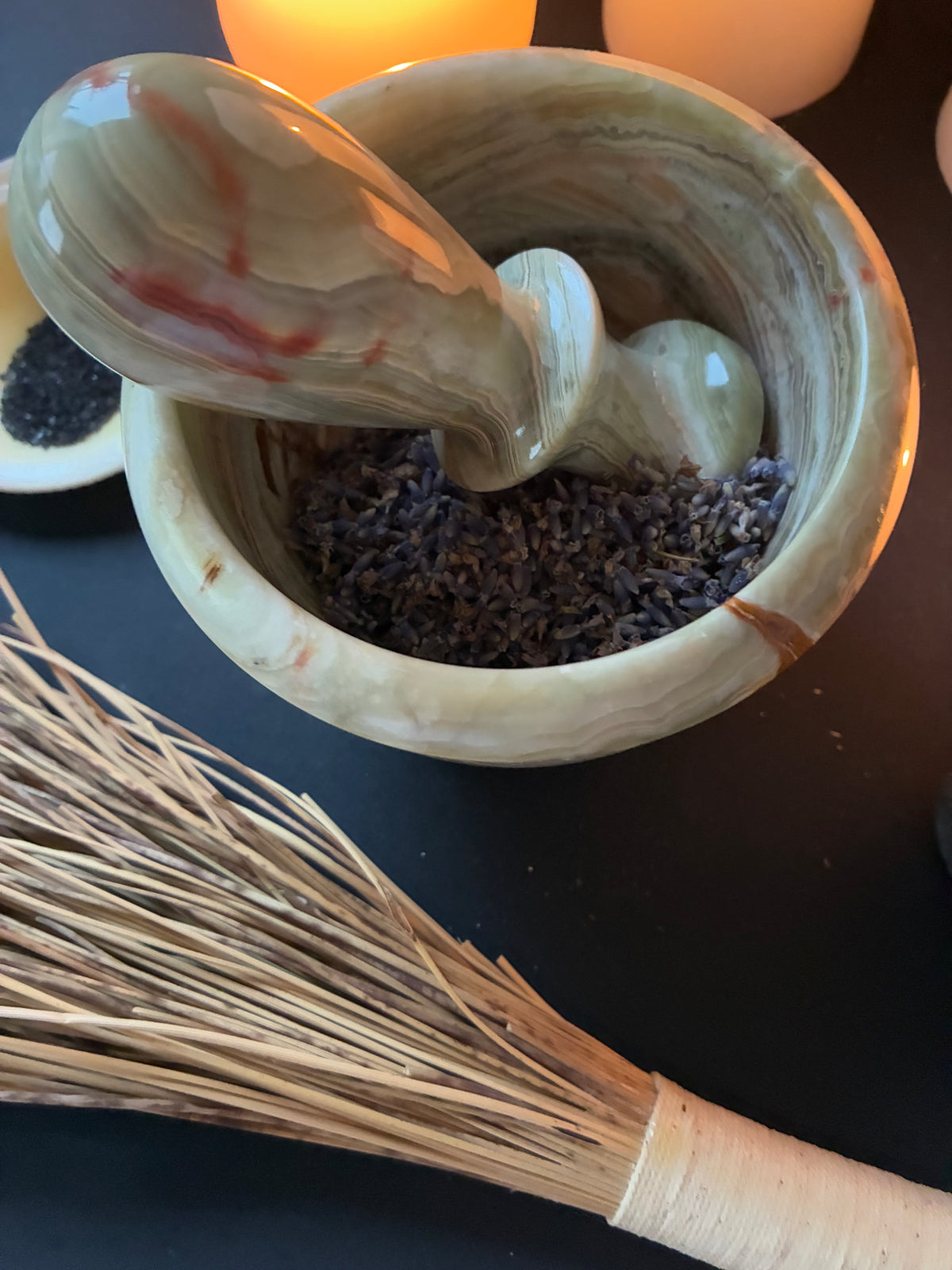 Green onyx mortar and pestle with dried lavender flowers