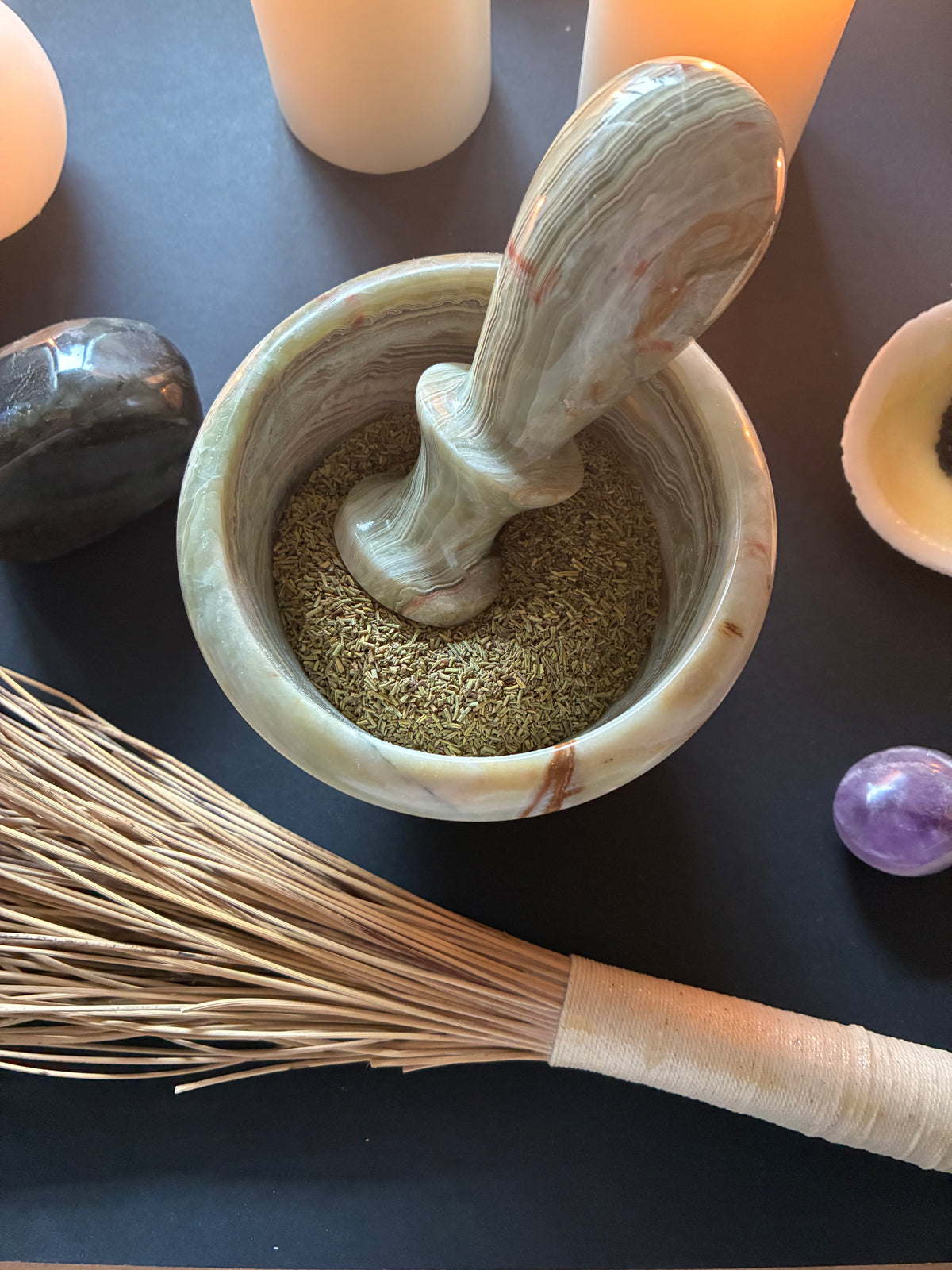 Green onyx mortar and pestle with dried rosemary herb